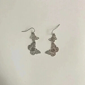 Silver butterfly dangle earrings.